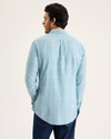 Back view of model wearing Lichen Men's Slim Fit Icon Button Up Shirt.