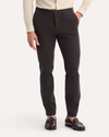 Front view of model wearing Licorice Crafted Khaki Pants, Slim Tapered Fit.