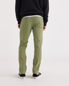 Back view of model wearing Loden Green Alpha Chino Pants, Skinny Fit.