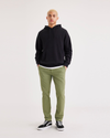 Front view of model wearing Loden Green Alpha Chino Pants, Skinny Fit.