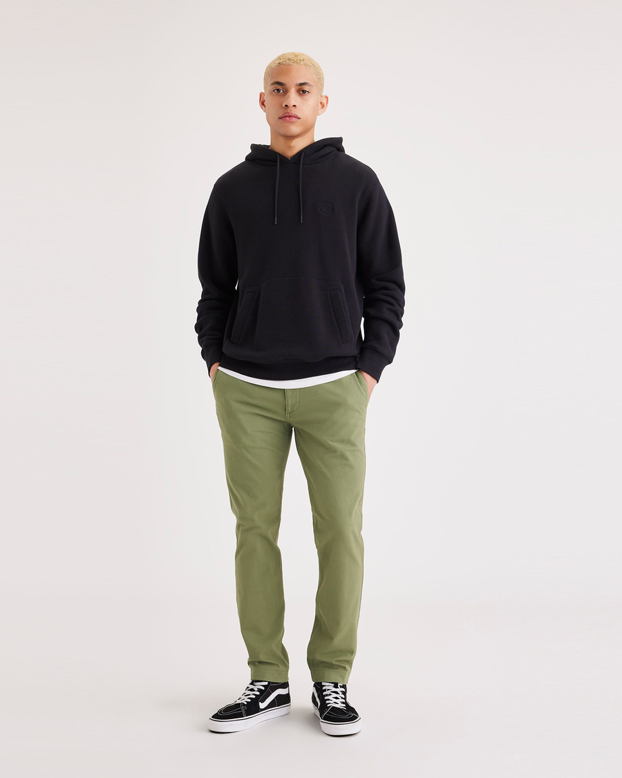 Front view of model wearing Loden Green Alpha Chino Pants, Skinny Fit.