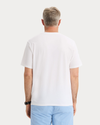 Back view of model wearing Lucent White Graphic Tee, Regular Fit.