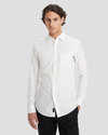 Front view of model wearing Lucent White Men's Slim Fit Icon Button Up Shirt.