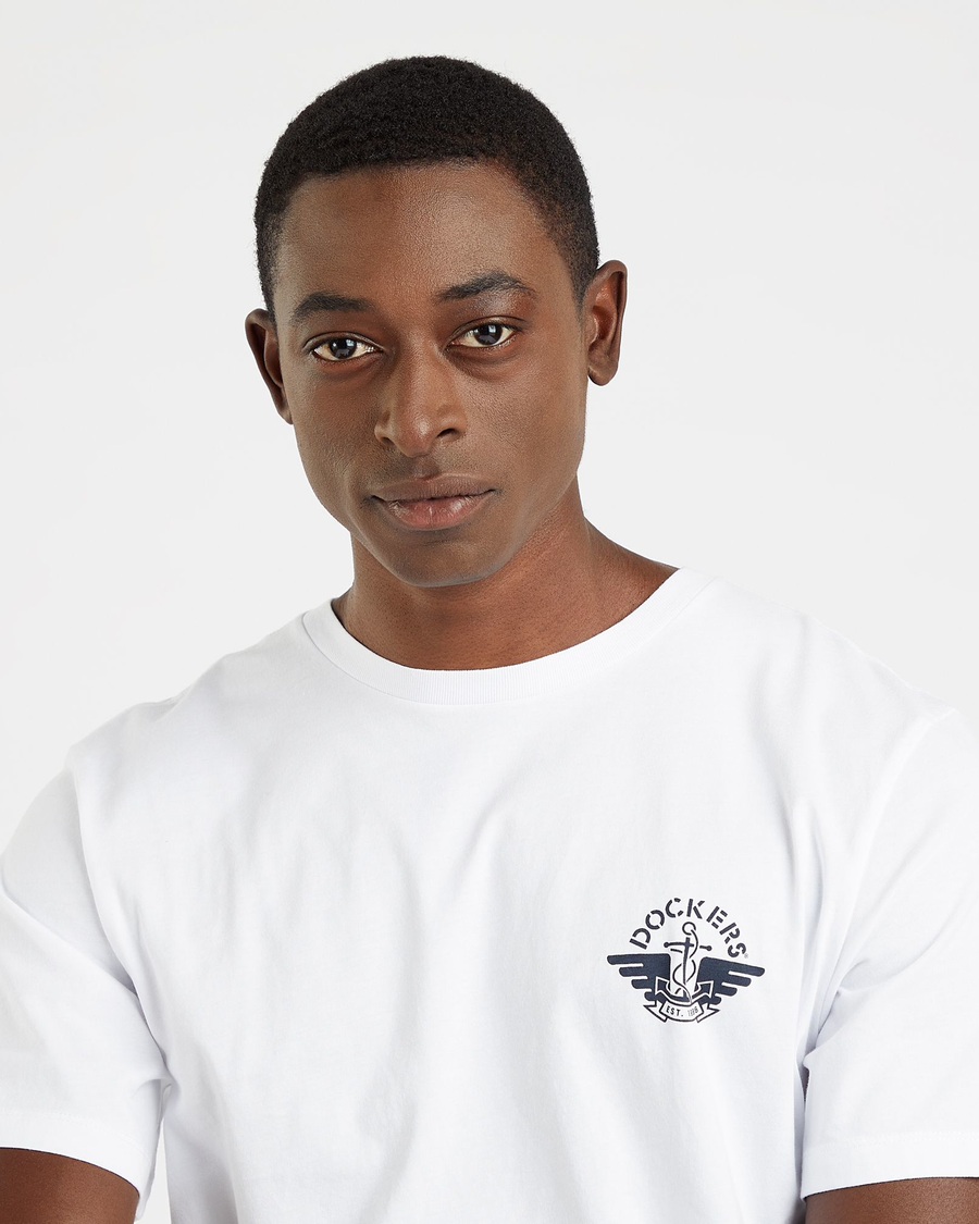 View of model wearing Lucent White Men's Slim Fit Logo Tee.