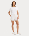 View of model wearing Lucent White Original Chino Shorts.