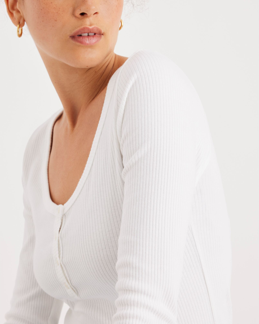 View of model wearing Lucent White Women's Long Sleeve Henley.