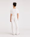 Back view of model wearing Lucent White Women's Straight Fit Carpenter Pants.