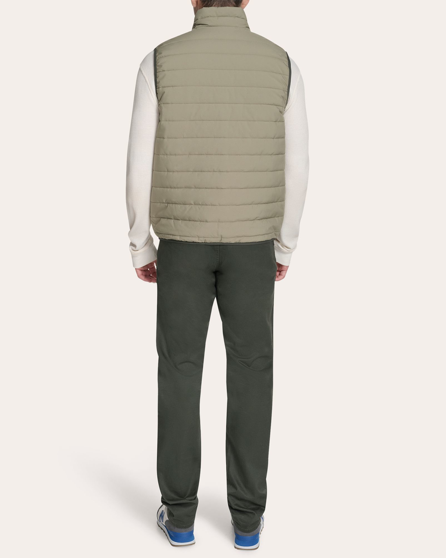 View of model wearing Mermaid Reversible Puffer Vest.