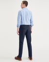 Back view of model wearing Navy Blazer Alpha Chino Pants, Slim Fit.