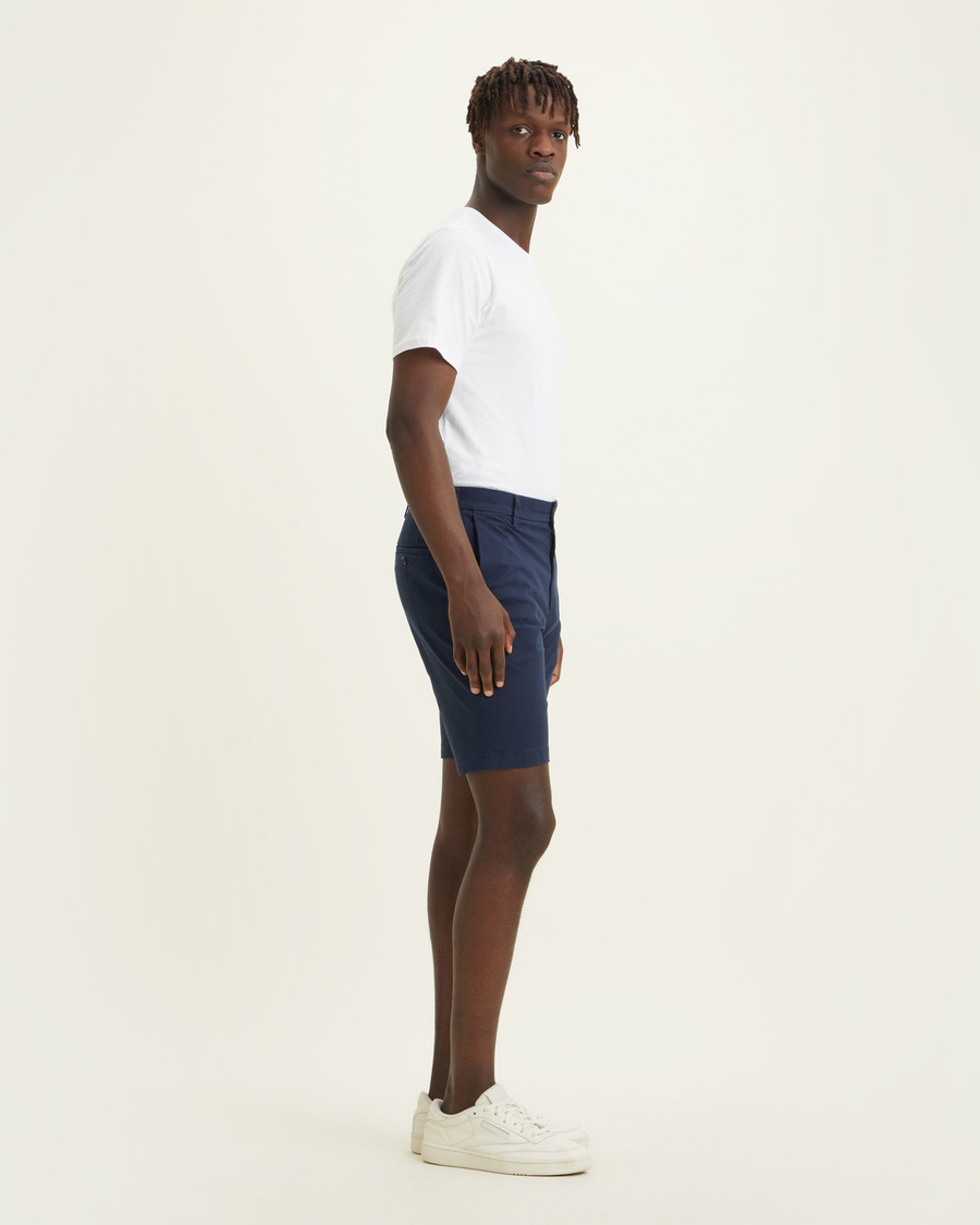Side view of model wearing Navy Blazer Big and Tall Supreme Flex Modern Chino Shorts.