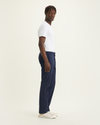 Side view of model wearing Navy Blazer Big and Tall Tapered Fit Supreme Flex Pants.