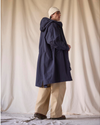 Back view of model wearing Navy Blazer Dockers® x Transnomadica Squall Coat.