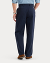 Back view of model wearing Navy Blazer Eighty-Six Original Chino Pants, Loose Fit.