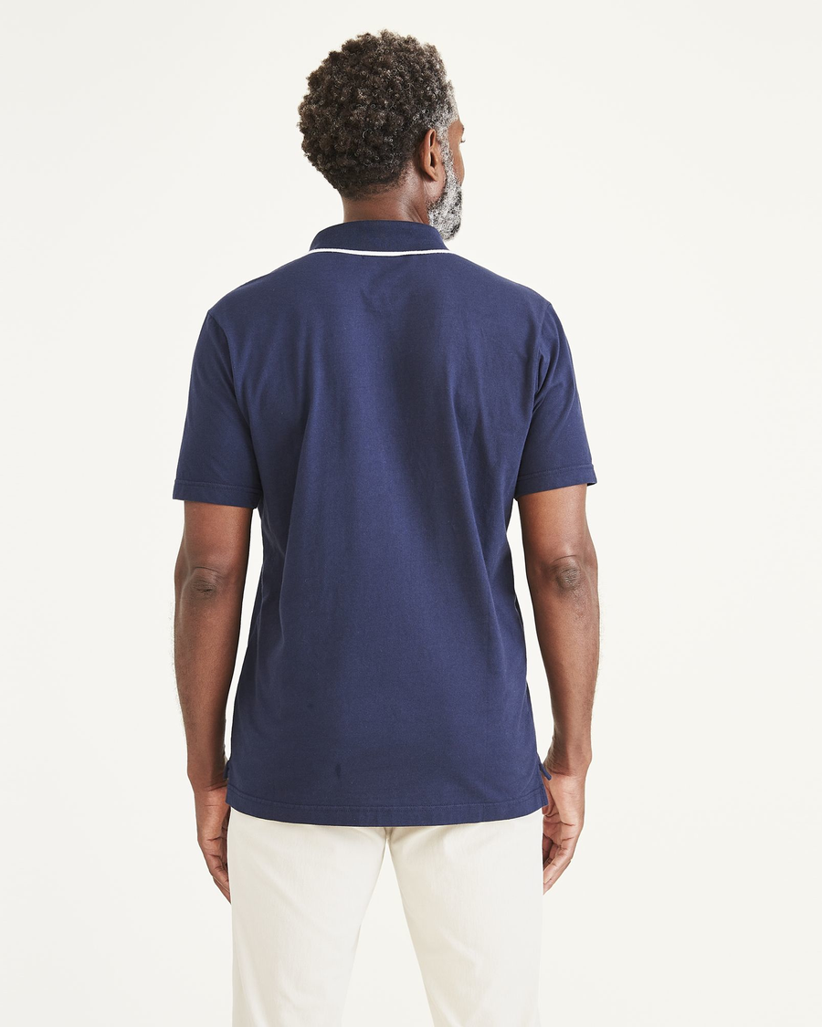 Back view of model wearing Navy Blazer Men's Perfect Polo.