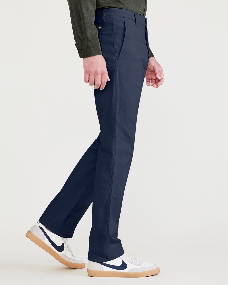 Side view of model wearing Navy Blazer Men's Slim Fit Original Chino Pants.