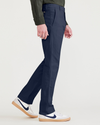 Side view of model wearing Navy Blazer Men's Slim Fit Original Chino Pants.