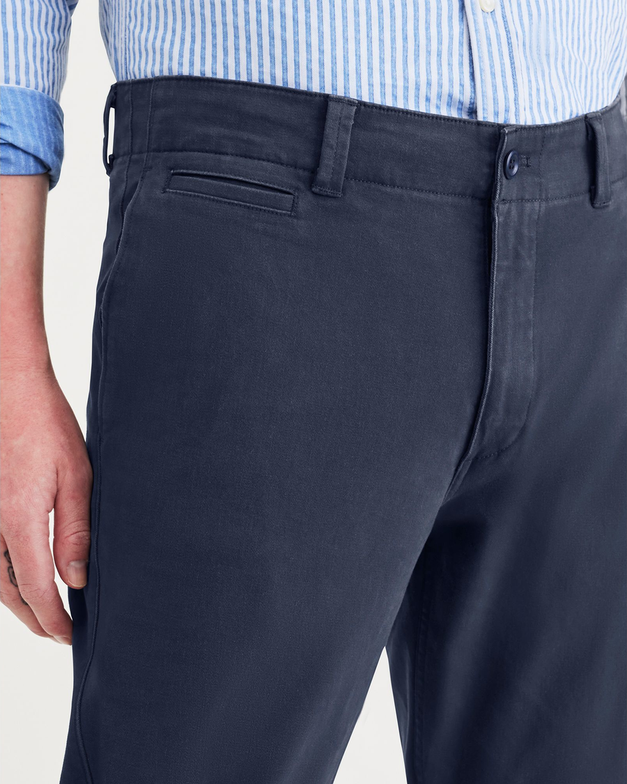 View of model wearing Navy Blazer Men's Slim Fit Smart 360 Flex California Chino Pants.