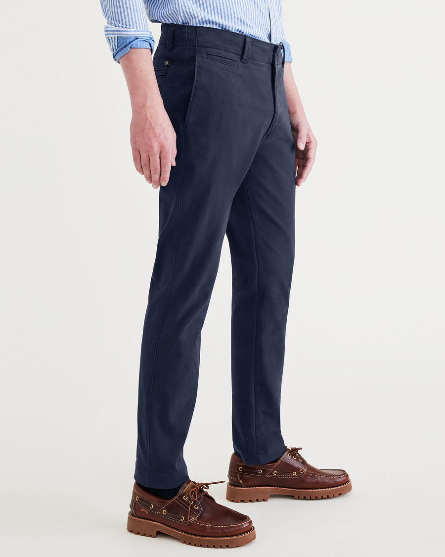 Side view of model wearing Navy Blazer Men's Slim Fit Smart 360 Flex California Chino Pants.