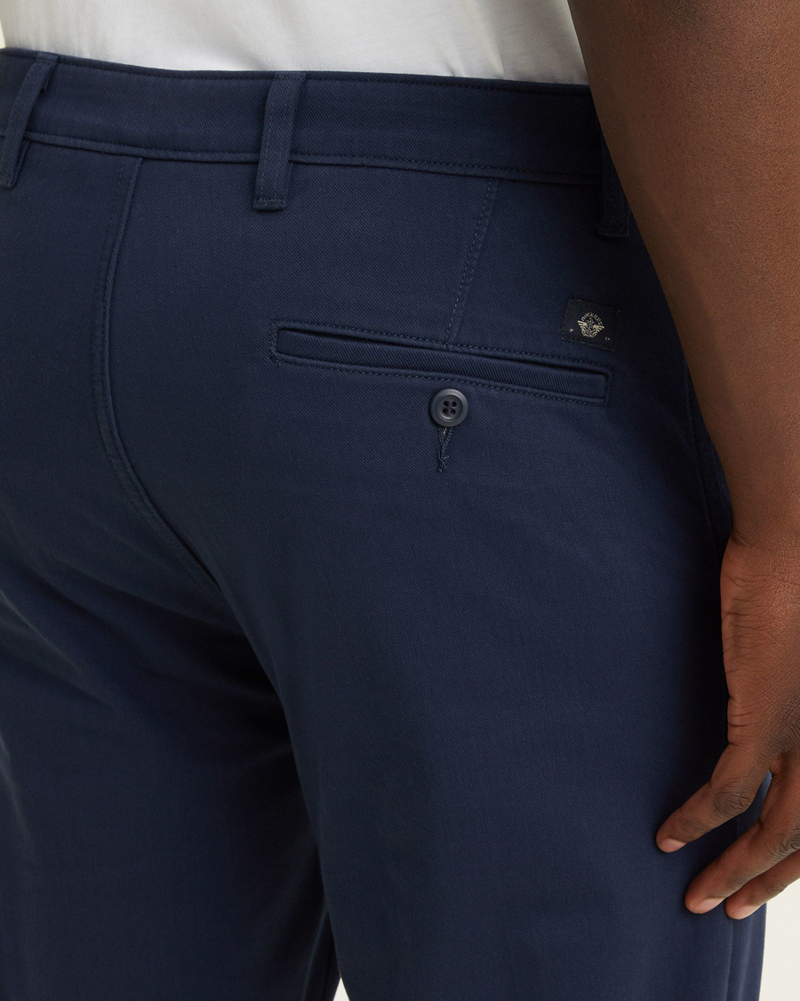 View of model wearing Navy Blazer Men's Slim Fit Supreme Flex Alpha Khaki Pants.