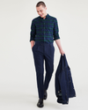 View of model wearing Navy Blazer Men's Slim Tapered Fit Crafted Pants.
