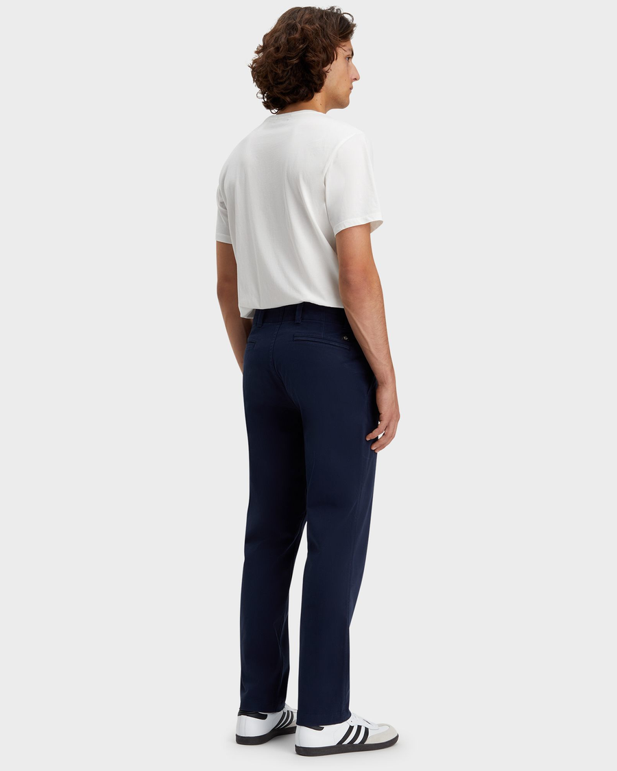 Back view of model wearing Navy Blazer Men's Straight Fit Smart 360 Flex California Chino Pants.