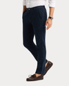 Side view of model wearing Navy Blazer Original Chino Pants, Slim Fit.