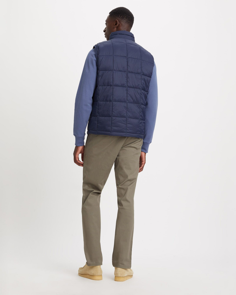 Back view of model wearing Navy Blazer Quilted Vest, Regular Fit.