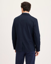 Back view of model wearing Navy Blazer Signature Refined Blazer, Regular Fit.