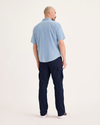 Back view of model wearing Navy Blazer Utility Cargo Pant, Straight Fit.