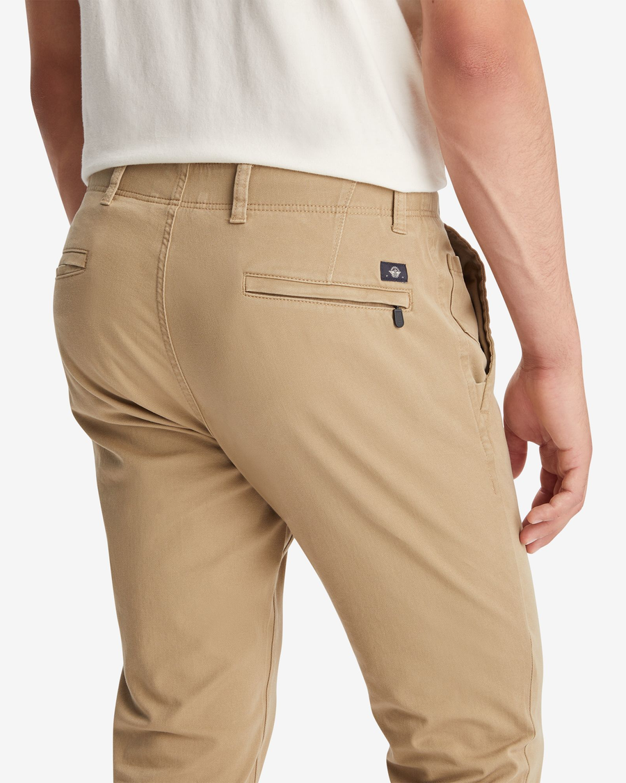 View of model wearing New British Khaki Men's Skinny Fit Smart 360 Flex Alpha Khaki Pants.