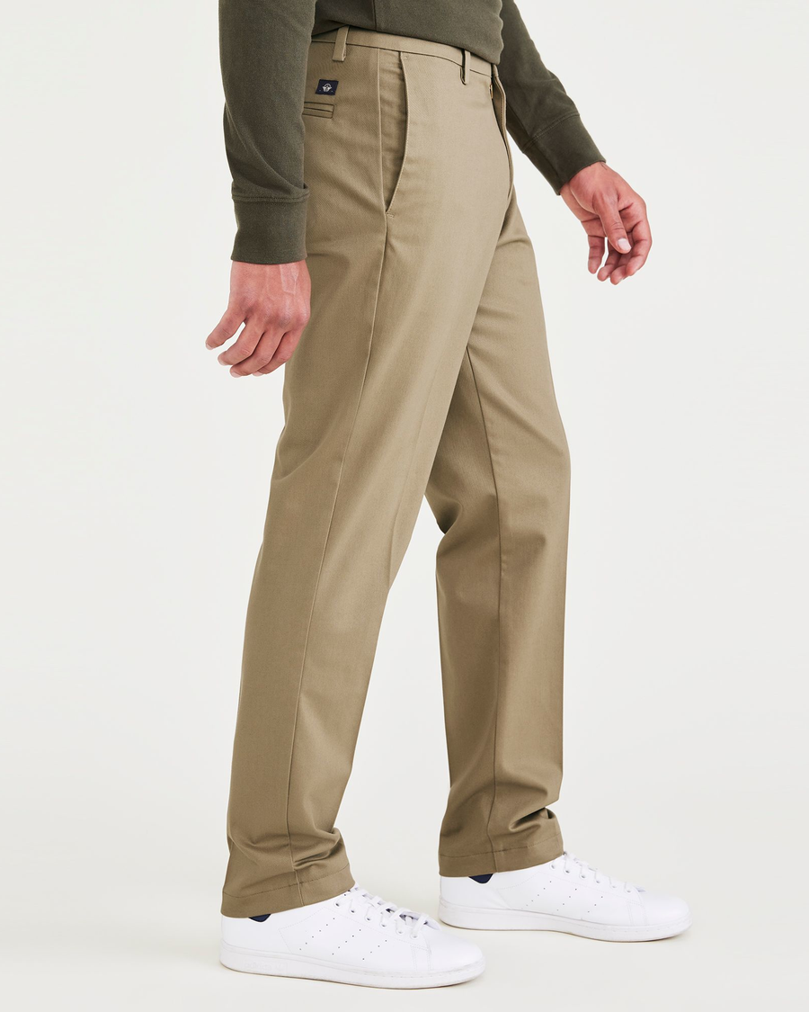 Side view of model wearing New British Khaki Signature Iron Free Khakis, Creased, Slim Fit with Stain Defender®.