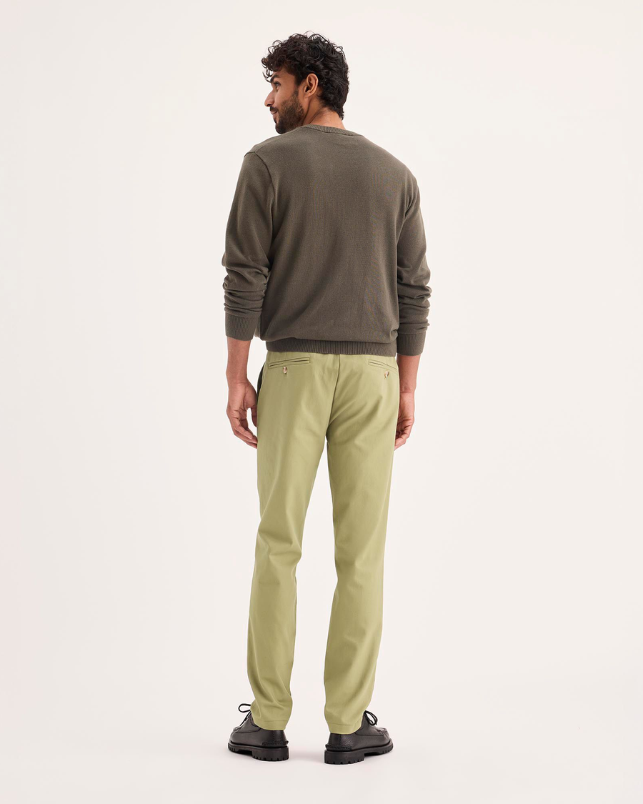 Back view of model wearing New British Khaki Signature Iron Free Khakis, Skinny Fit with Stain Defender®.