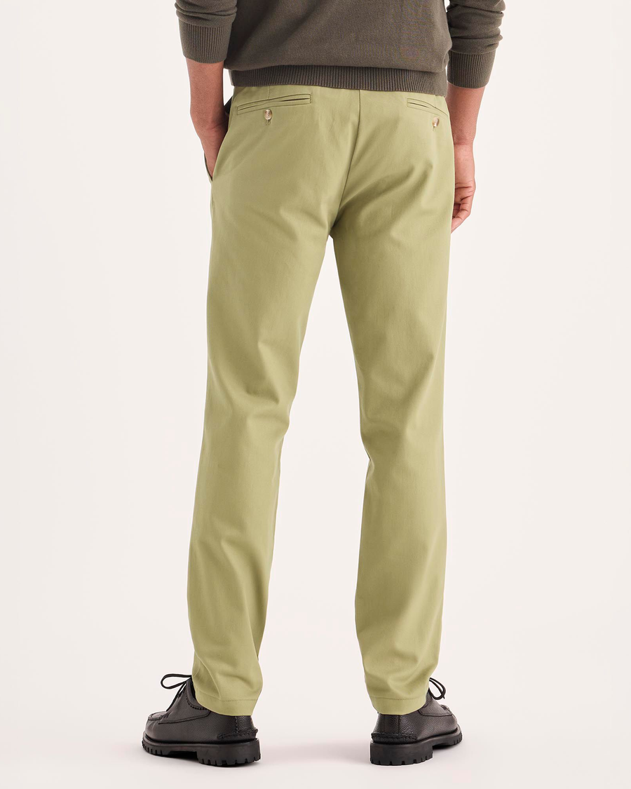 Back view of model wearing New British Khaki Signature Iron Free Khakis, Skinny Fit with Stain Defender®.