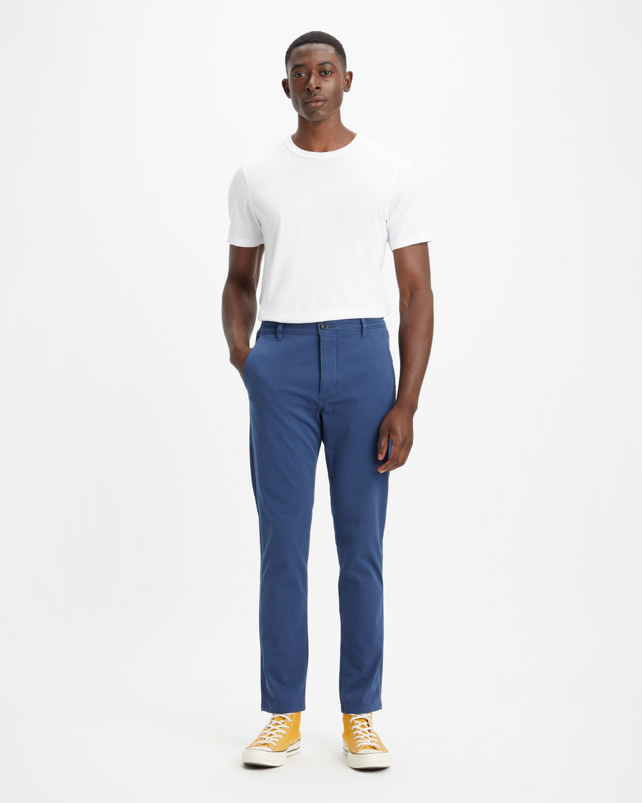 Front view of model wearing Ocean Blue Men's Skinny Fit Supreme Flex Alpha Khaki Pants.