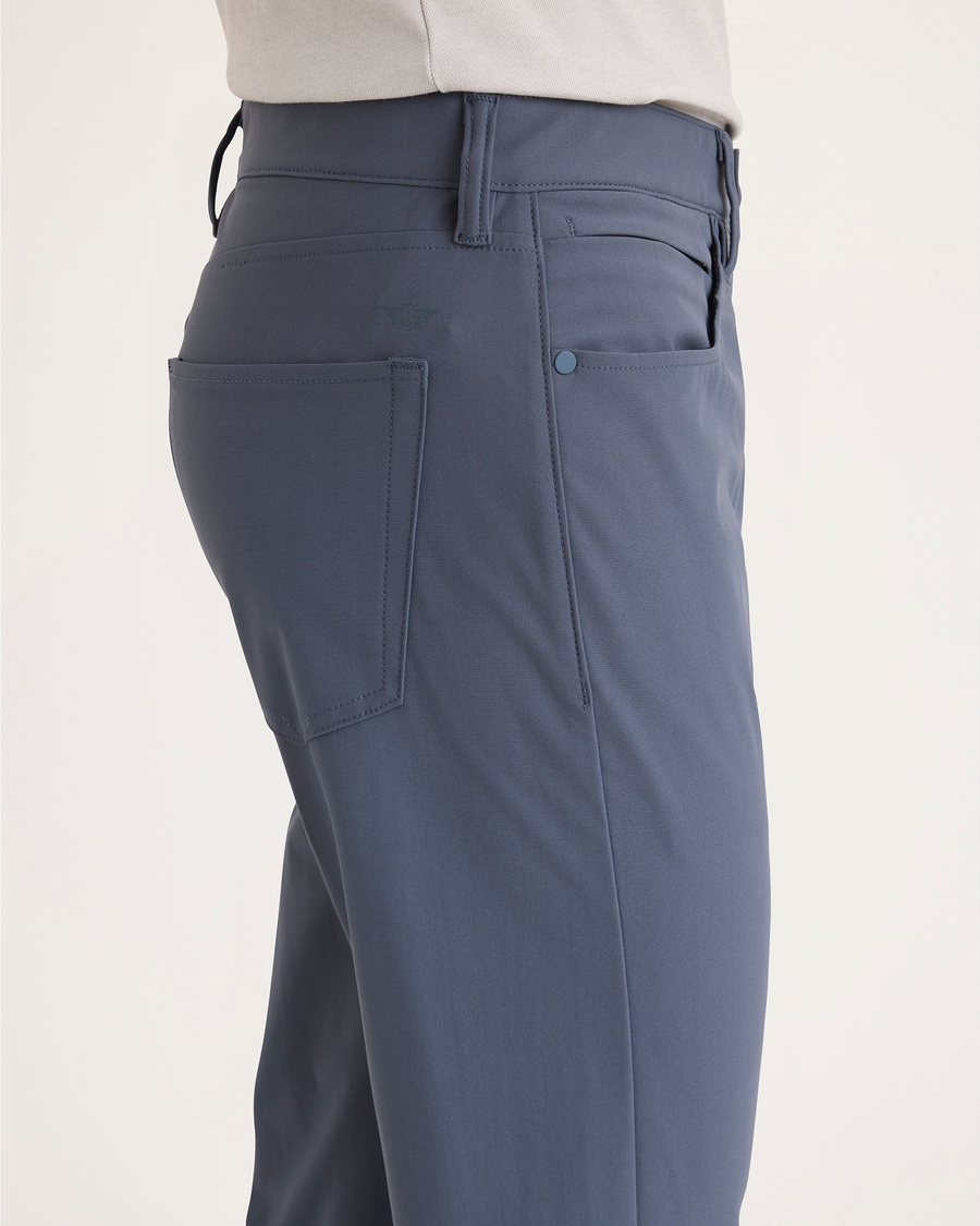 Side view of model wearing Ombre Blue Go Airweave 5-Pocket, Slim Tapered Fit.