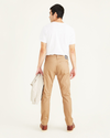 Back view of model wearing Otter Men's Slim Fit Smart 360 Flex Jean Cut Pants.