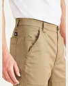 View of model wearing Otter Men's Straight Fit Utility Pants.