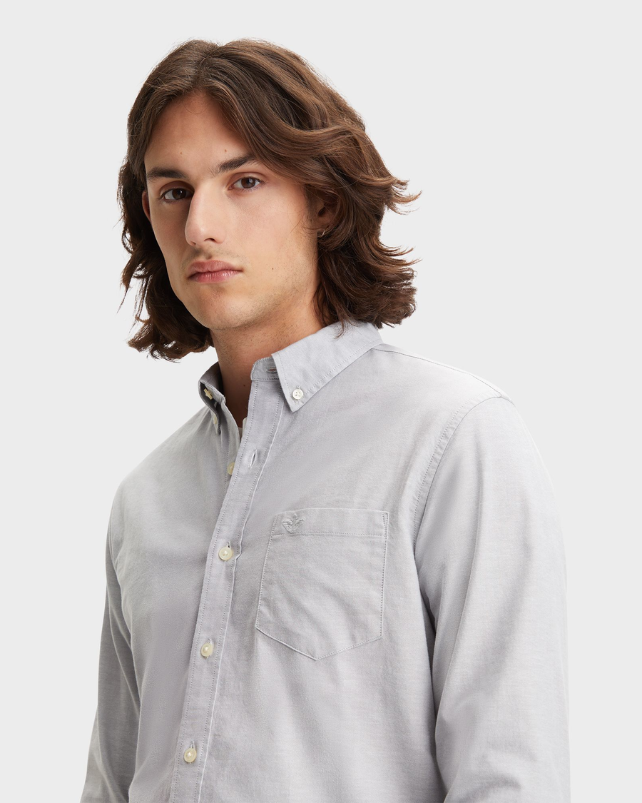 View of model wearing Oxford Medium Grey Heather Men's Slim Fit 2 Button Collar Shirt.