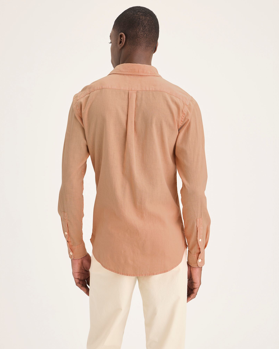 Back view of model wearing Peach Bloom Men's Slim Fit Icon Button Up Shirt.