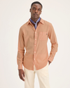 Front view of model wearing Peach Bloom Men's Slim Fit Icon Button Up Shirt.