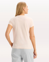 Back view of model wearing Peach Blush Graphic Tee, Slim Fit.