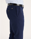 Side view of model wearing Pembroke Men's Slim Fit Smart 360 Flex Workday Khaki Pants.