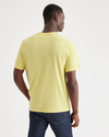 Back view of model wearing Pineapple Slice Men's Regular Fit Original Tee Shirt.