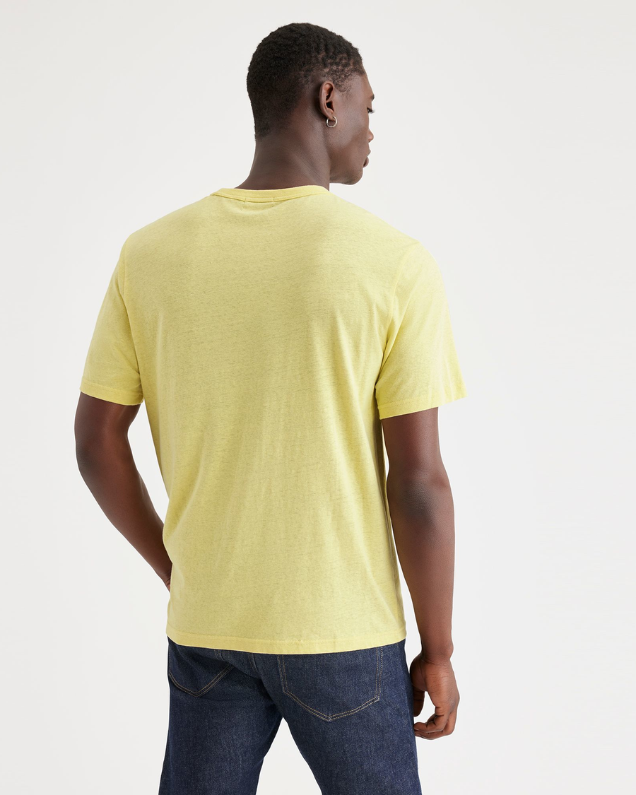 Back view of model wearing Pineapple Slice Men's Regular Fit Original Tee Shirt.