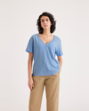 Front view of model wearing Placid Blue Women's Deep V-Neck Tee Shirt.