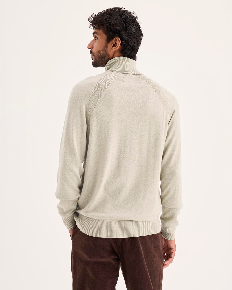 Back view of model wearing Pure Cashmere Turtleneck Sweater, Regular Fit.