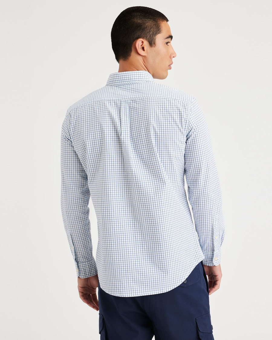 Back view of model wearing Ripple Powder Blue Men's Slim Fit Icon Button Up Shirt.