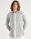 Front view of model wearing Rock Grey Heather Men's Slim Fit Icon Button Up Shirt.