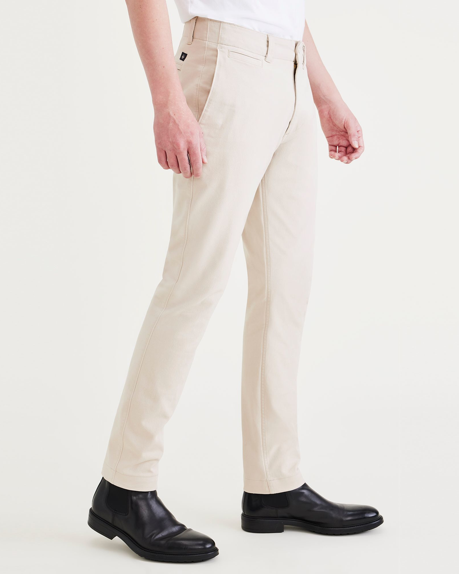 Side view of model wearing Sahara Khaki Alpha Chino Pants, Slim Fit.