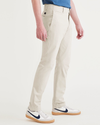 Side view of model wearing Sahara Khaki Men's Skinny Fit Smart 360 Flex California Chino Pants.